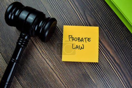Photo for Concept of Probate Law write on sticky notes with gavel isolated on Wooden Table. - Royalty Free Image