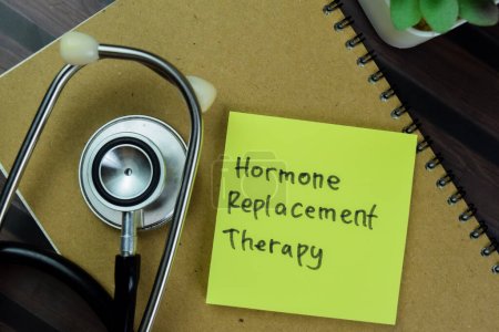Concept of Hormone Replacement Therapy write on sticky with keywords notes isolated on Wooden Table.