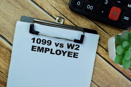 Photo for Concept of 1099 vs w2 Employee write on paperwork isolated on Wooden Table. - Royalty Free Image