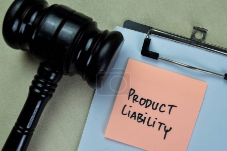 Concept of Product Liability write on sticky notes with gavel isolated on Wooden Table.