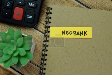 Photo for Concept of Neobank write on sticky notes isolated on Wooden Table. - Royalty Free Image