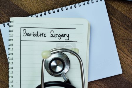 Concept of Bariatric Surgery write on book isolated on Wooden Table.