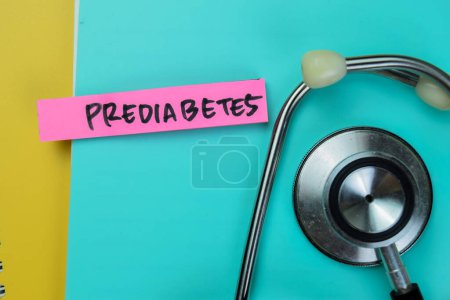 Photo for Concept of Prediabetes write on sticky notes with stethoscope isolated on Wooden Table. - Royalty Free Image