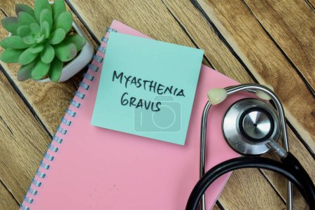 Concept of Myasthenia Gravis write on sticky notes isolated on Wooden Table.