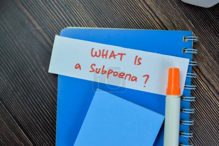 Photo for Concept of What is Subpoena write on sticky notes isolated on Wooden Table. - Royalty Free Image