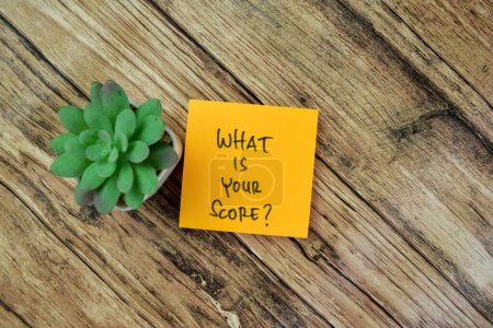 Photo for Concept of What is Your Score? write on sticky notes isolated on Wooden Table. - Royalty Free Image