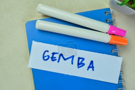 Photo for Concept of Gemba write on sticky notes isolated on Wooden Table. - Royalty Free Image