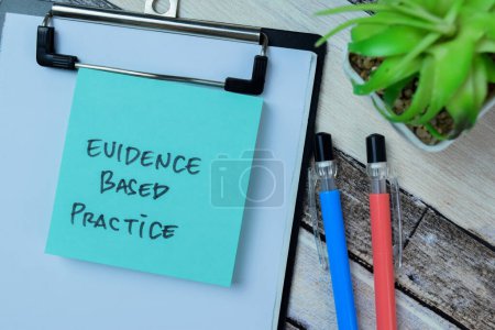 Photo for Concept of Evidence Based Practice write on sticky notes isolated on Wooden Table. - Royalty Free Image