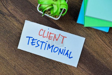 Photo for Concept of Client Testimonial write on sticky notes isolated on Wooden Table. - Royalty Free Image