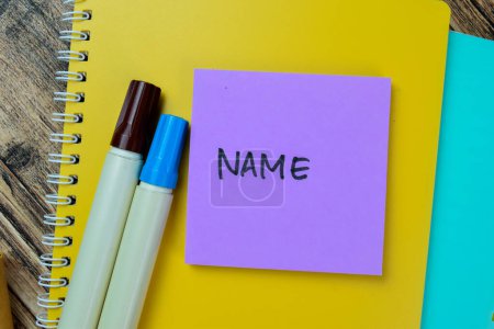 Concept of Name write on sticky notes isolated on Wooden Table.