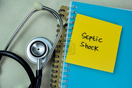 Concept of Septic Shock write on sticky notes isolated on Wooden Table.