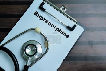 Concept of Buprenorphine write on paperwork with stehoscope isolated on wooden background.