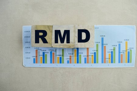 Concept of The wooden Cubes with the word RMD - Requirement Minimum Distributions on wooden background.