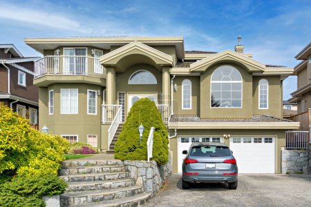 Photo for Luxury residential house with a car parked in front on cloudy day in Vancouver, Canada - Royalty Free Image