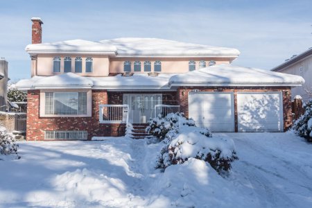 Big residential house in snow on winter season in Canada