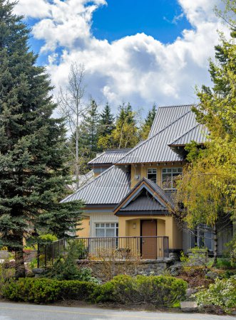Entrance of luxurious residential house with big roof on spring season in Canada