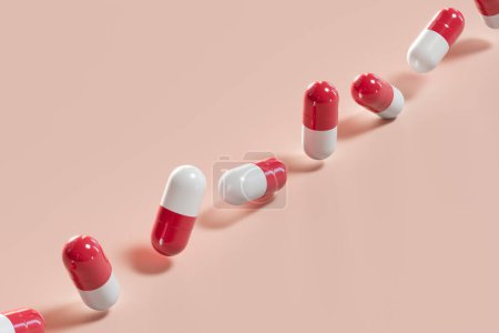 Photo for A row of red and white capsules colorful capsules lined up on a bright background. Perfect for medical, pharmaceutical, or healthcare themes. Includes vitamins, supplements, painkillers,  antibiotics. - Royalty Free Image