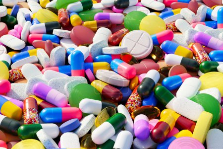 Unzählige Pillen, Kapseln und Tabletten in verschiedenen Farben bilden dieses lebendige Bild, das perfekt für die Darstellung von Medizin, Pharmazie und Gesundheitsindustrie geeignet ist..