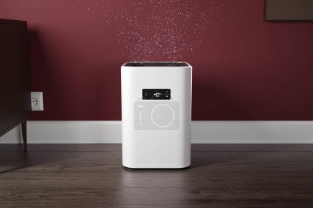 Photo for A modern wireless air humidifier, perfect for a smart home. Releases water molecules to keep the air fresh and healthy. Upgrade your domestic lifestyle with this new electronic accessory. - Royalty Free Image