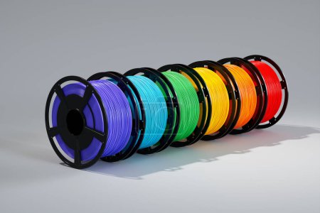 Photo for A close-up of different colored thermoplastic filament spools used for 3D printing. These filaments, made of materials such as PLA, ABS, and PET-G, are essential for creating 3D prints - Royalty Free Image