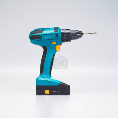 Photo for This 3D rendering image features a brand new cordless drill in a modern design with turquoise and orange details. Perfect for renovation and repair projects to construction work. - Royalty Free Image
