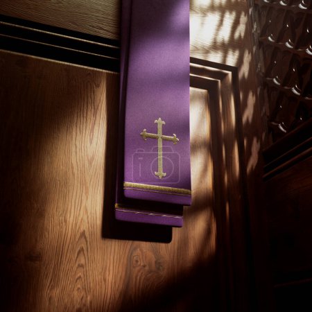 Photo for Purple stole with cross lightened by rays of light falling into a confessional. Christian chapel details. Place in a catholic church to confess sins. Sacrament. Symbol of Devine mercy, forgiveness - Royalty Free Image