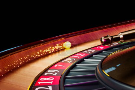 Photo for Close up shot of a spinning roulette. Presentation of a luxury casino roulette wheel with a yellow spinning fireball. Polished, elegant roulette with golden elements in Las Vegas. Gambling. Lucky game - Royalty Free Image