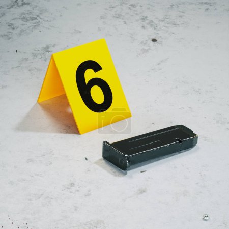 Photo for Picture of the murder site with pieces of evidence of the crime. Forensic evidence on the floor. Criminal police investigation. Gun's magazine with bullets lying on the ground. Crime scene - Royalty Free Image