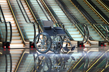 Footage of empty wheelchair next to the escalator. Concept of health problems, disabilities, handicaps, rehabilitation. Mobility matters. Issues of lack of accessibility and barriers in public spaces.