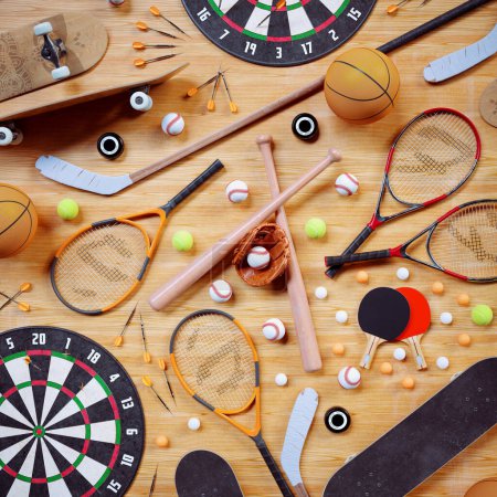 Variety of game equipment. Aerial view on sports gear for baseball, tennis, ping-pong, hokey, darts, skateboarding, basketball. Sports balls, bats and racquets on floor