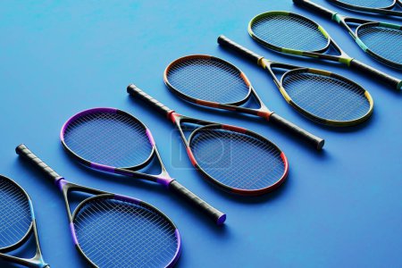 Photo for Set of colorful sports equipment for tennis. Tennis kits in various paintings. Rental or sale of tennis racquets. Presenting and selling professional sports accessories. Choose your favorite. - Royalty Free Image