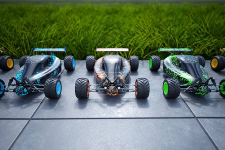 Multiple colourful remote-controlled buggy cars on a sidewalk in an endless row.  Sunny day and clear blue sky. Fresh green grass in the background.