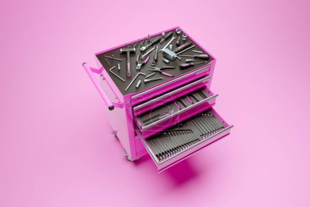 Photo for The workshop tools locker. Hammers, screwdrivers, wrenches, spanners, pincers, torx and hex keys in the pink metal cabinet. Studio shot. Equipment. Mechanical maintenance. Perfect toolbox. Isolated - Royalty Free Image