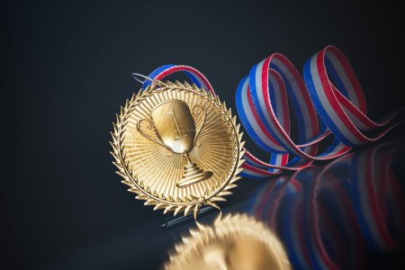 Photo for Gold medal for a top winner in a dark studio on a reflective surface. First prize for a champion. Shiny sports award with ribbon. Symbol of winning competition, success, victory, championship, triumph - Royalty Free Image