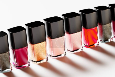 Photo for Vibrant nail polish bottles in an array of colors. Timeless fashion colors. Elegant glass bottles against a white background. Red, golden, nude nail varnish. Image captures the essence of modern women - Royalty Free Image