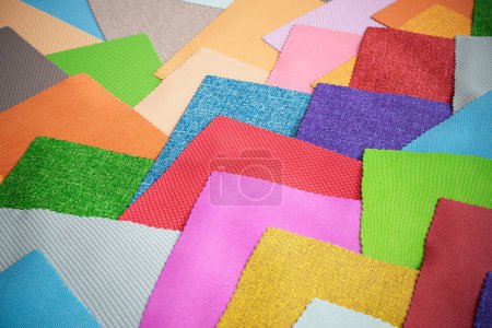 Photo for A set of colorful fabric samples. Square pieces of material in various colors. Concept of textile decoration trends for furniture or interiors. DIY enthusiast. Textile designer. Collection of cloths. - Royalty Free Image