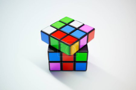 Téléchargez les photos : Image exquise rendue en 3D d'un cube de puzzle multicolore vibrant posé sur un fond blanc immaculé, projetant une ombre subtile et mettant en valeur une complexité qui stimule l'acuité mentale. - en image libre de droit
