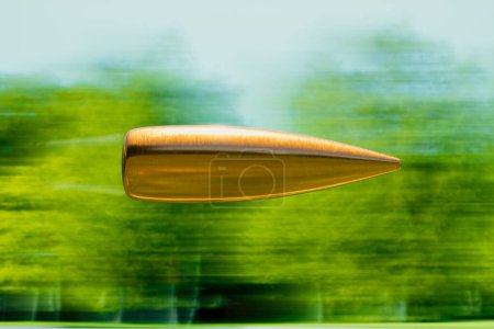 A captivating copper-hued object seemingly floats mid-air with a striking backdrop of motion-blurred green, crafting an image that melds serenity and momentum in a harmonious confluence.