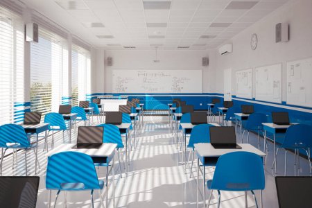 Téléchargez les photos : Une vaste salle de classe ensoleillée équipée d'ordinateurs portables ouverts, signalant une approche progressive de l'éducation interactive et numérique dans un espace d'apprentissage contemporain. - en image libre de droit