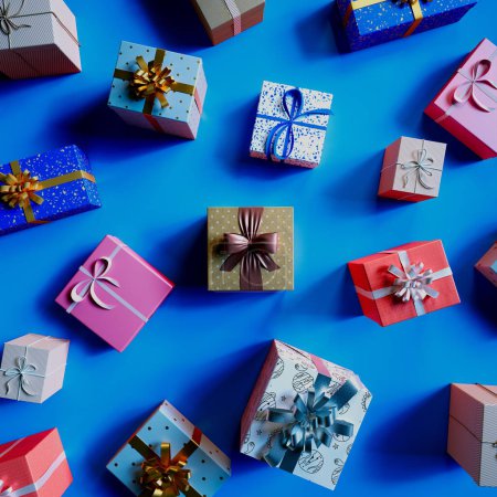 Téléchargez les photos : Une sélection méticuleusement organisée de boîtes-cadeaux vibrantes à motifs ornés de rubans festifs repose sur un fond bleu frappant, parfait pour toute occasion de célébration. - en image libre de droit