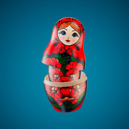 Foto de Muñecas de anidación Matryoshka rusas vívidamente pintadas, que muestran una intrincada artesanía floral roja sobre un fondo azul contrastante, personificando el arte popular tradicional. - Imagen libre de derechos