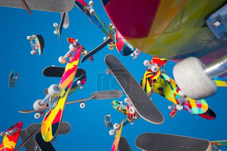 Eine optisch eindrucksvolle Szene, die eine Sammlung farbenfroher Skateboards festhält, die in der Luft schweben und vor dem ruhigen Hintergrund eines klaren blauen Himmels kontrastiert.