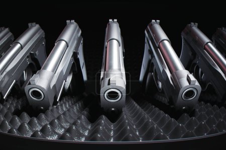 Un éventail d'armes de poing modernes sophistiquées avec une finition argentée et noire, méticuleusement disposées sur un fond texturé pour mettre en valeur le design et l'artisanat.