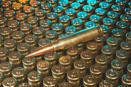 Dieses Nahaufnahme-Foto fängt eine Sammlung von aufeinander abgestimmten metallischen Kugeln ein, wobei eine vertikal positioniert wird und die Individualität inmitten der Uniformität der Schusswaffenmunition betont wird..