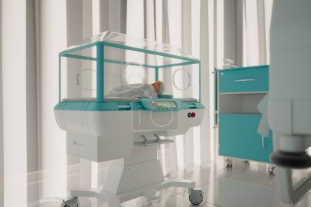 Foto de Una incubadora neonatal sofisticada está lista en una guardería hospitalaria, diseñada para el máximo cuidado y protección de los recién nacidos prematuros y en riesgo, garantizando su seguridad. - Imagen libre de derechos