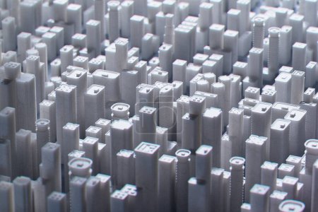 This image captures a captivating mock-up of a bustling metropolis using monochromatic toy building blocks, showcasing a striking resemblance to a real urban skyline.