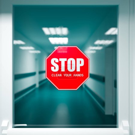 Foto de Un marcado cartel rojo de "Stop Clean Your Hands" se adhirió a una ventana de vidrio del pasillo del hospital, haciendo hincapié en la importancia crítica del saneamiento de las manos para la seguridad sanitaria.. - Imagen libre de derechos