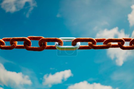 Photo for This high-resolution image features a stark contrast between corroded chains and a gleaming metal link, symbolizing strength and renewal against a vividly blue cloudy backdrop. - Royalty Free Image