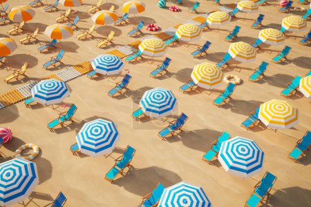 Foto de Esta cautivadora fotografía aérea muestra un animado paisaje de playa repleto de un caleidoscopio de sombrillas y tumbonas que bordean las suaves costas de arena, invitando al ocio y la relajación.. - Imagen libre de derechos