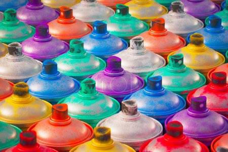Photo for A neatly organized top-view photo capturing a variety of spray paint cans, each bursting with potential for creative graffiti and street art projects. - Royalty Free Image